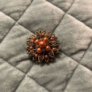 Elegant Gold and Orange Brooch